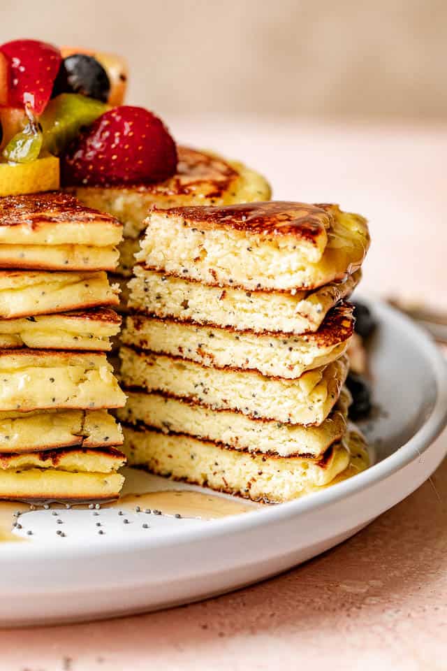 slicing out a stack of lemon poppyseed pancakes