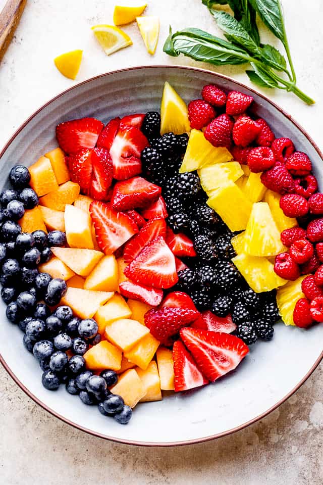 Bowl with blueberries, melon, strawberries, blackberries, pineapple and raspberries