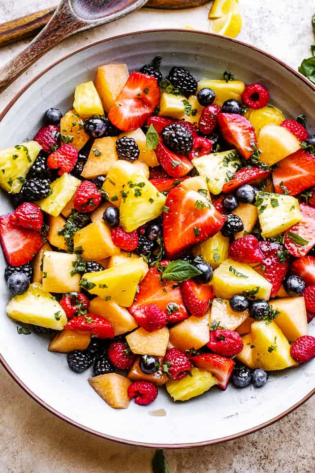 Overhead photo of a bowl filled with melon pineapple fruit salad