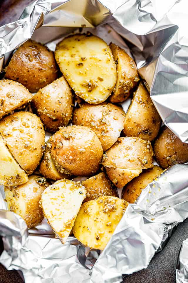 halved potatoes arranged in a foil pack