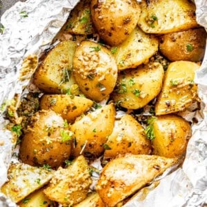 top view of cooked potatoes in foil packets