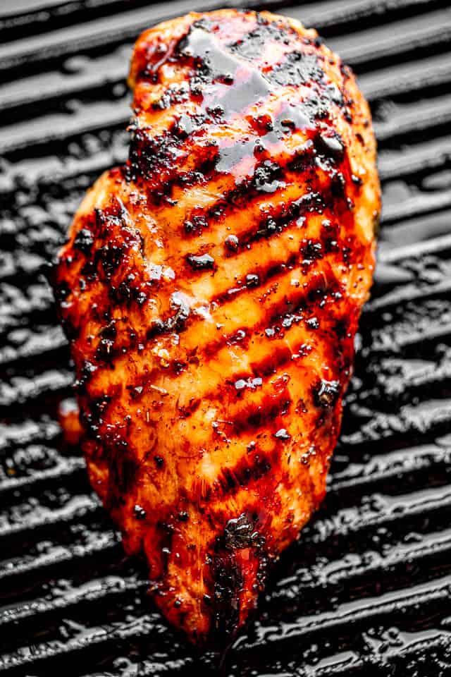 grilling chicken breasts on a grill