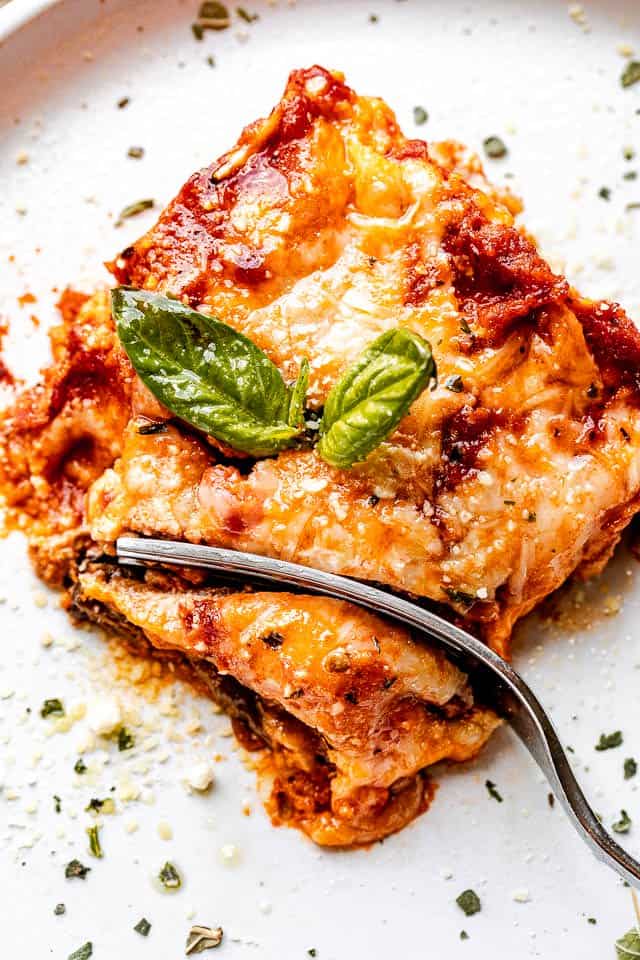 top view of a slice of eggplant lasagna with a fork through it