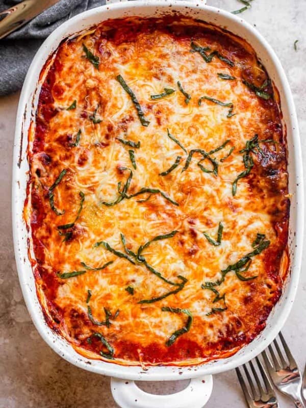 top shot of baked eggplant lasagna in a white baking dish