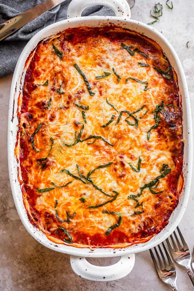 top shot of baked eggplant lasagna in a white baking dish