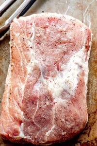 top shot of seasoned raw pork loin