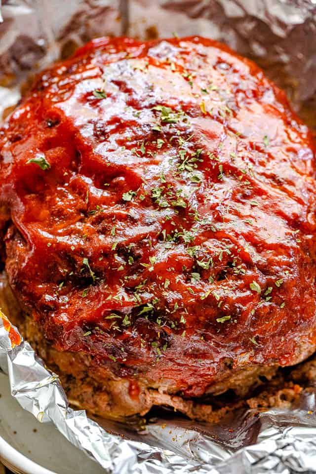 round cooked meatloaf on aluminum foil