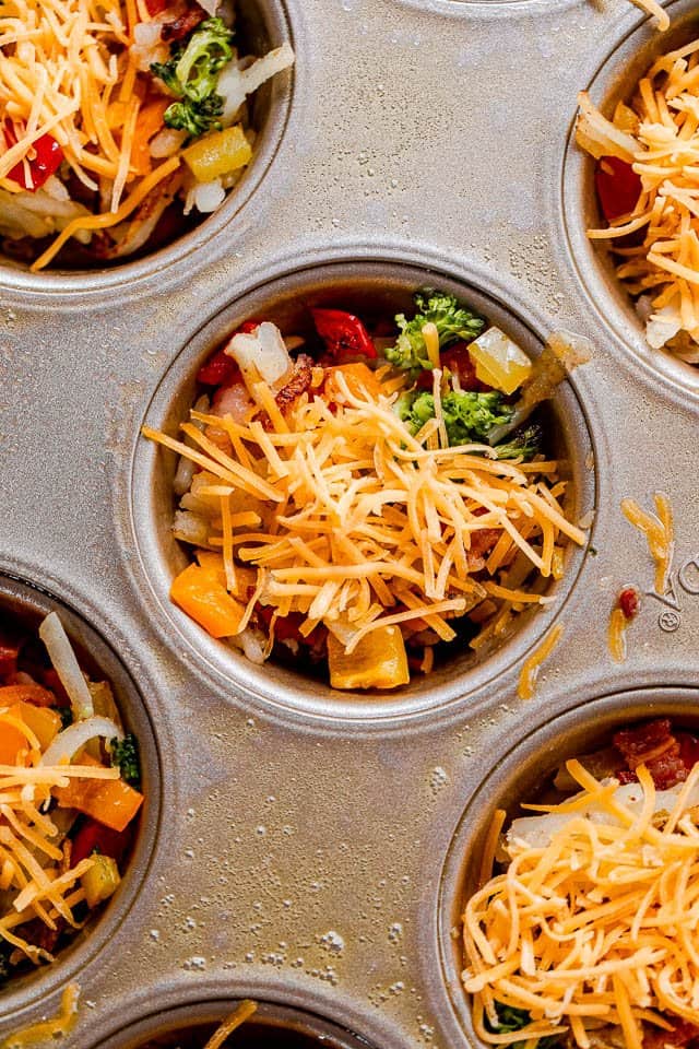 preparing breakfast muffins in a muffin tin