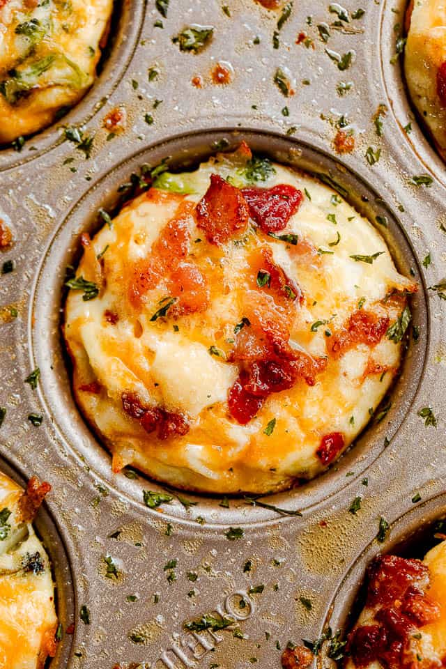 top shot of baked american breakfast egg muffins inside a muffin tin