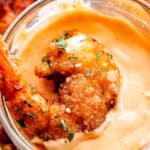 dipping bang bang shrimp in a mayo chili sauce