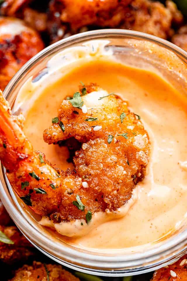 dipping bang bang shrimp in a mayo chili sauce