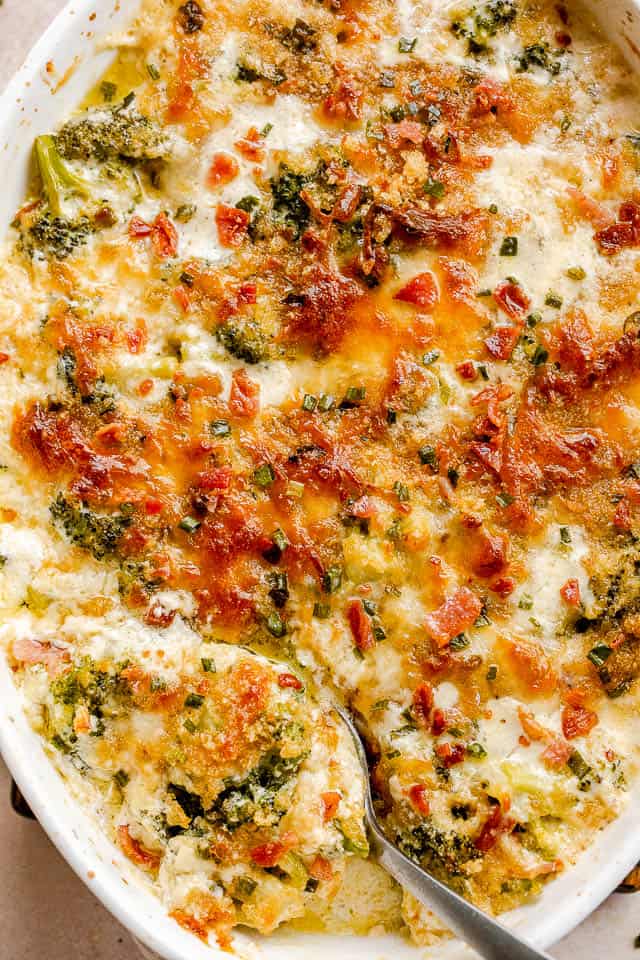 top view of broccoli cheese casserole in white baking dish