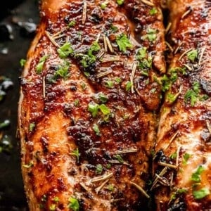 top view of cooked pork tenderloin on a dark background