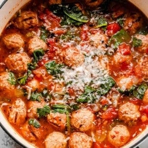 top shot of a white dutch oven filled with meatball soup
