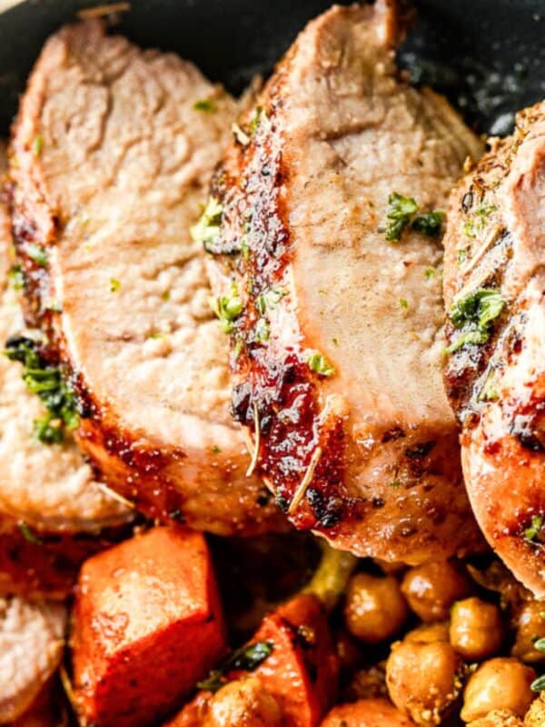 Instant pot pork tenderloin, sliced, and served in a bowl with chickpeas and sweet potatoes