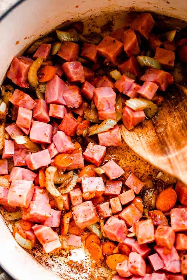 sauteeing ham and vegetables in a dutch oven