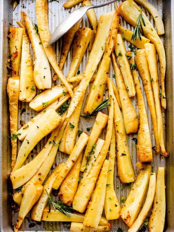 overhead shot of a baking sheet with roasted parsnips
