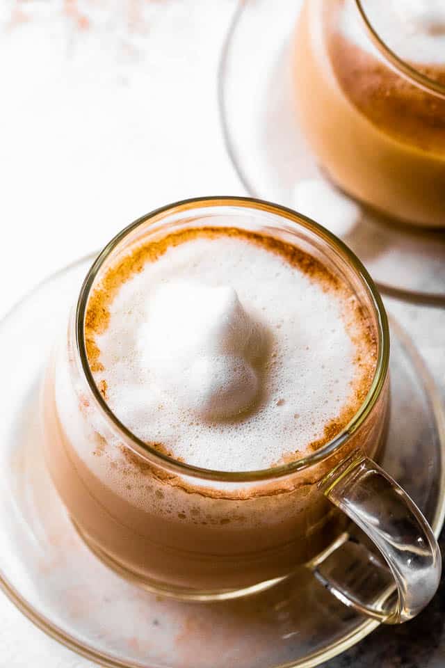 overhead shot of starbucks london fog drink topped with frothy milk