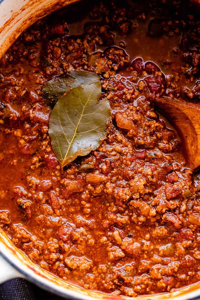 close up overhead shot of a cooked no beans chili in a white dutch oven