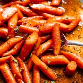close up shot of roasted carrots in cajun butter sauce