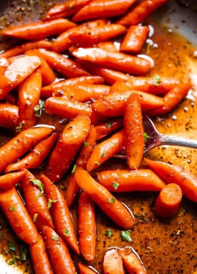 close up shot of roasted carrots in cajun butter sauce
