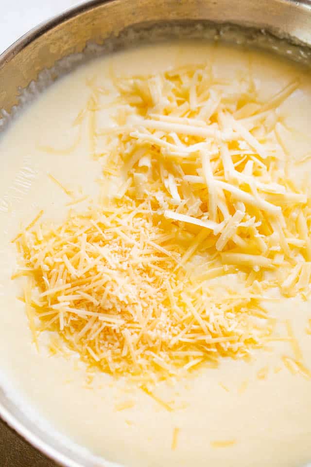 preparing cheese sauce in a skillet