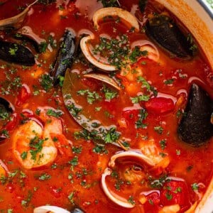 overhead close up photo of cioppino in a dutch oven