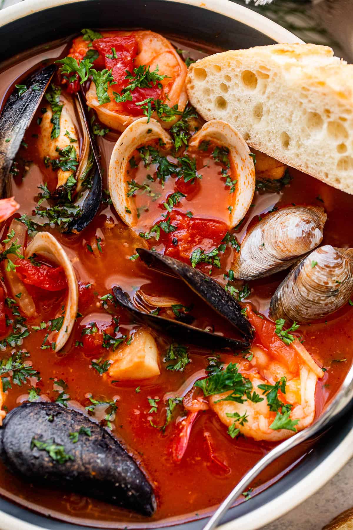 close up shot of cioppino stew in a soup bowl