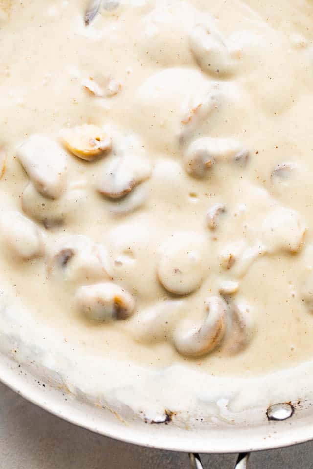 close up photo of creamy marsala wine sauce with mushrooms