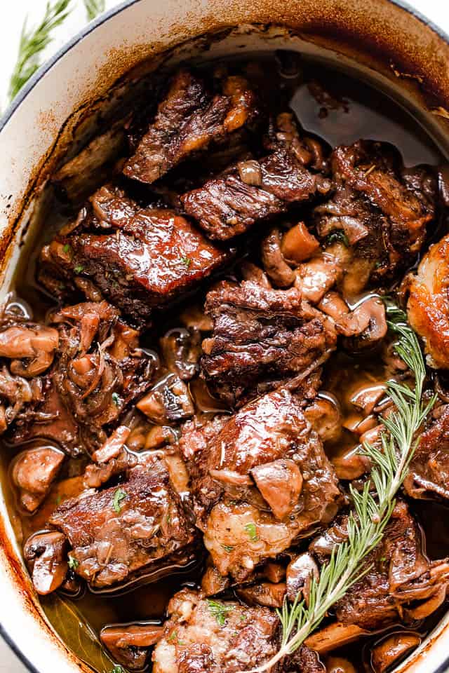 overhead shot of red wine braised beef short ribs in a slow cooker