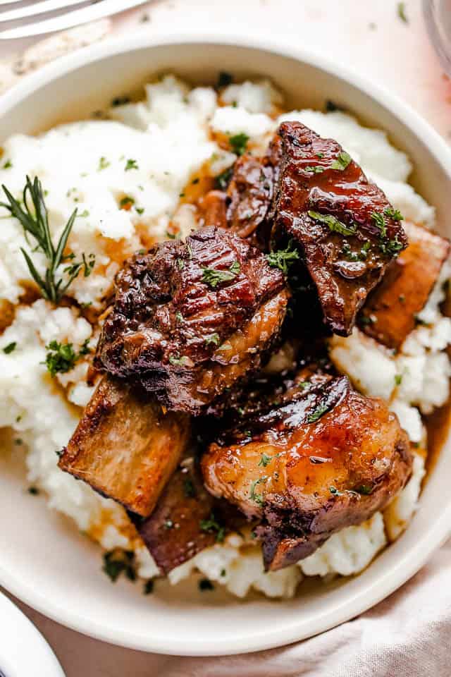 overhead shot of a plate with mashed potatoes and short ribs