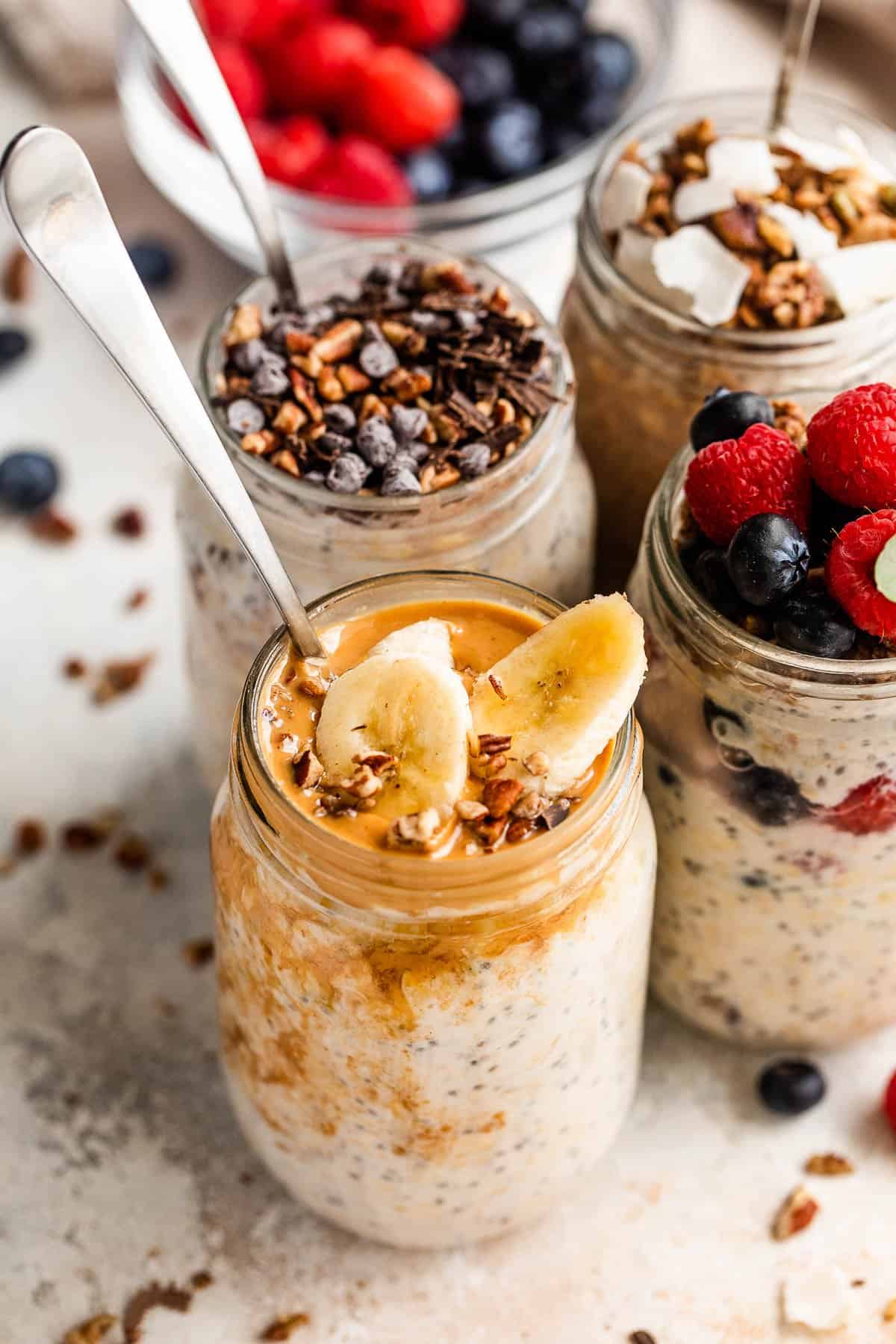 overnight oats in a jar garnished with peanut butter and sliced bananas