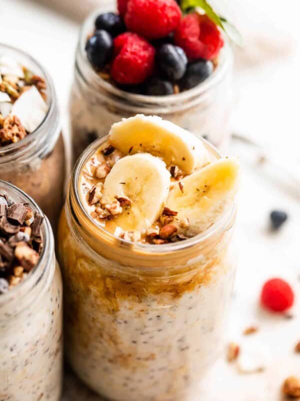 overnight oats in a jar garnished with peanut butter and sliced bananas