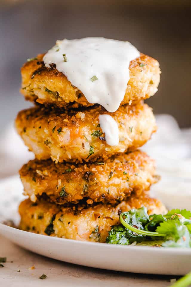 coconut shrimp cakes stacked up