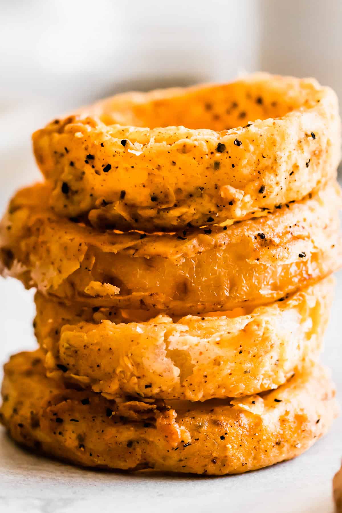 A stack of homemade onion rings.
