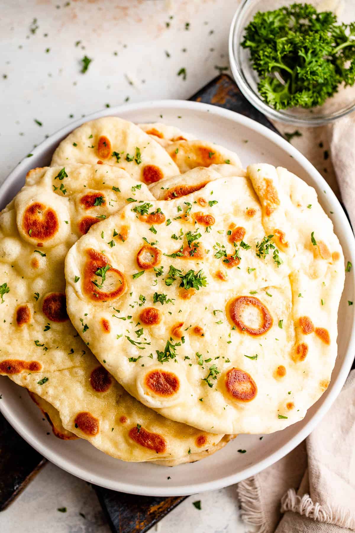 overhead shot of a stack of naan bread