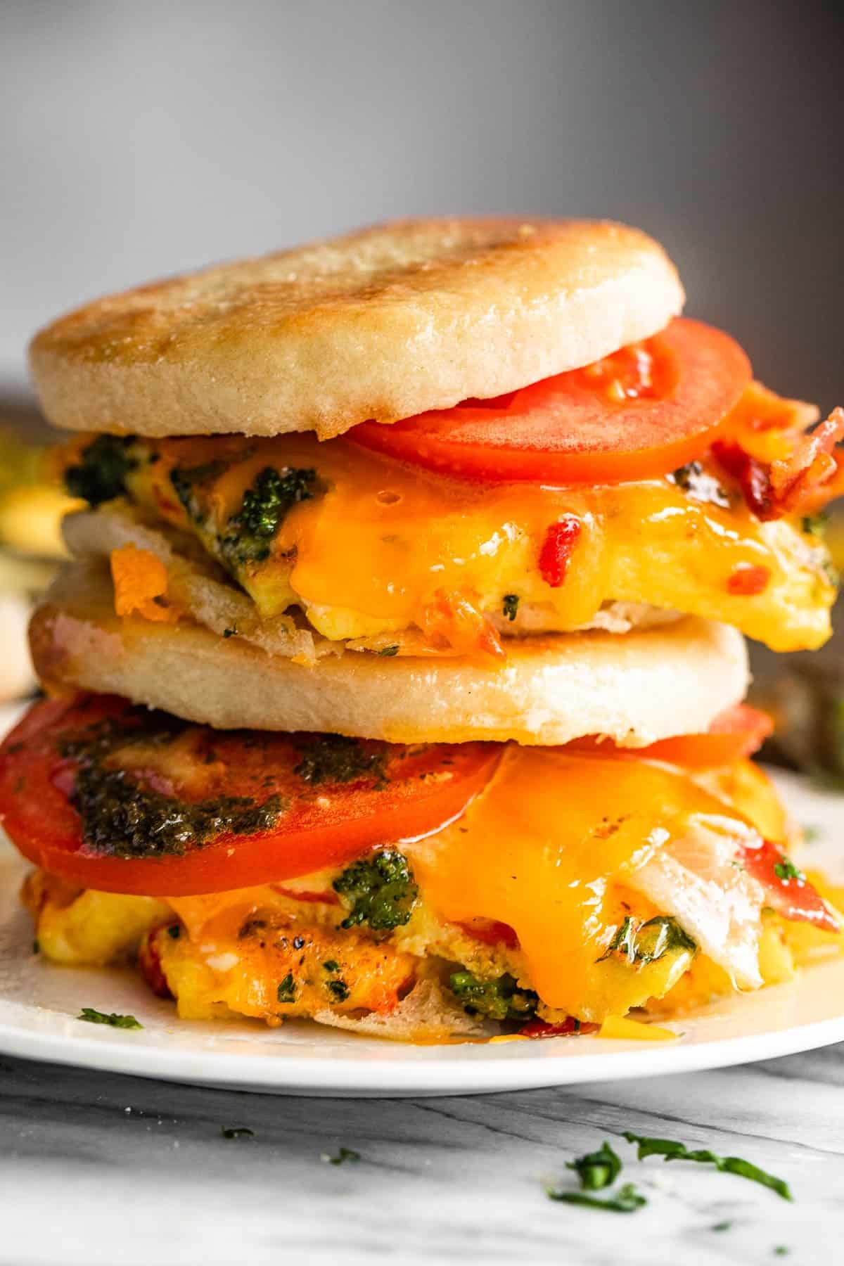 English muffin and egg sandwiches on a plate.