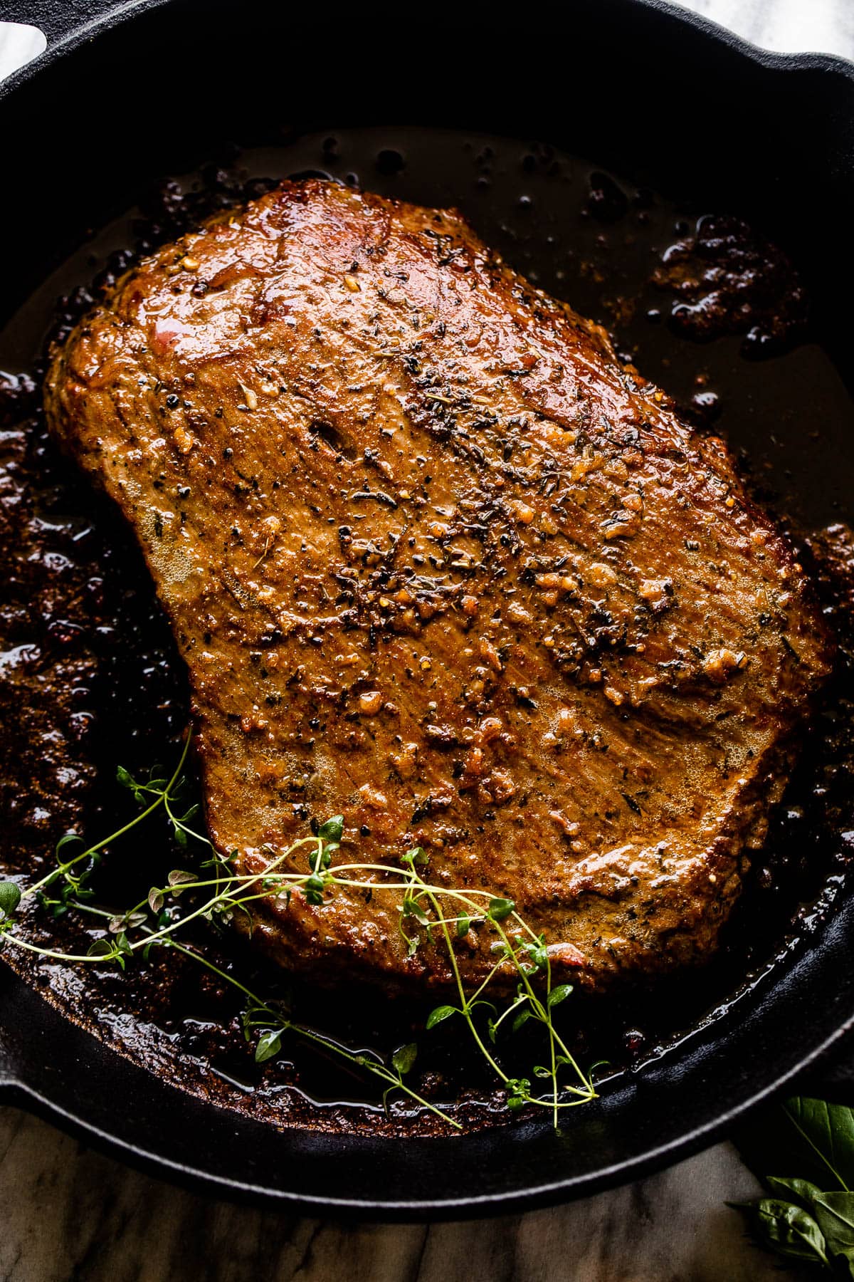 cooking london broil steak in a cast iron skillet