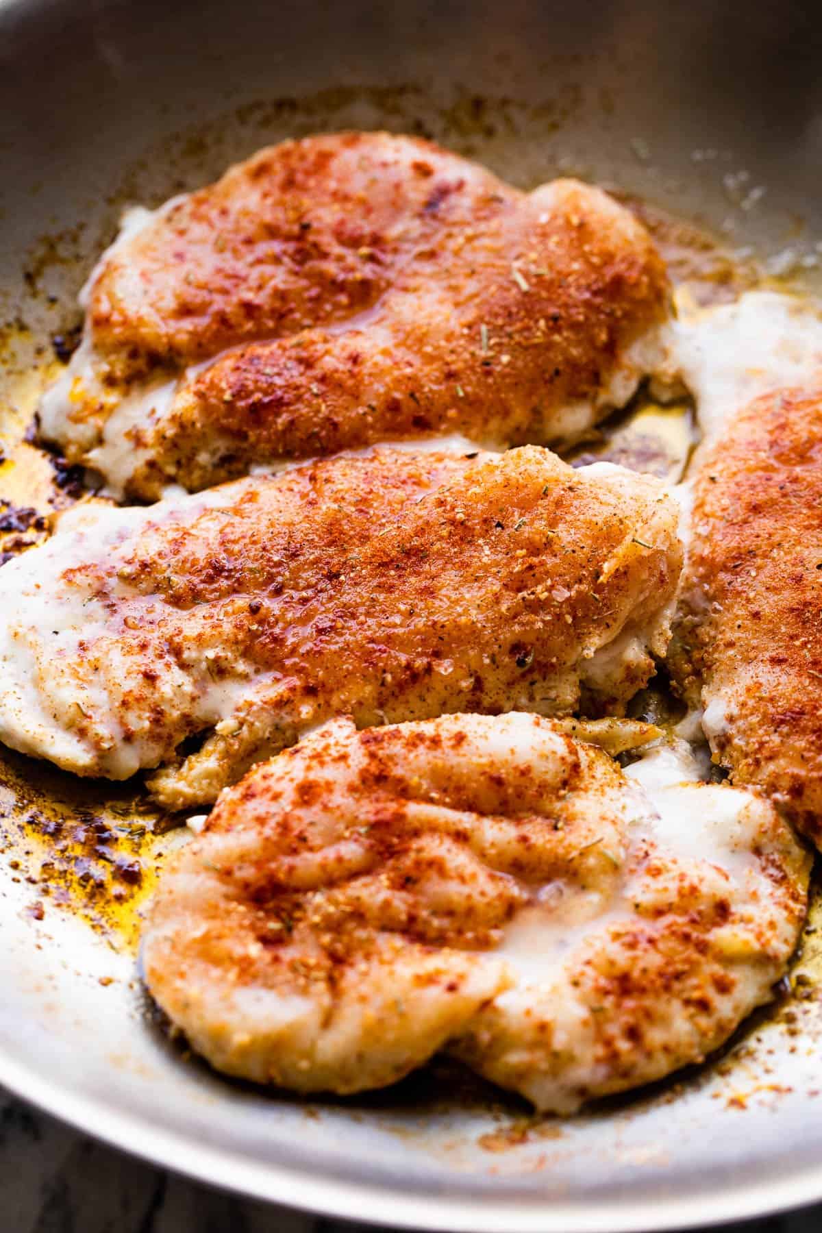 cooking chicken cutlets in a skillet