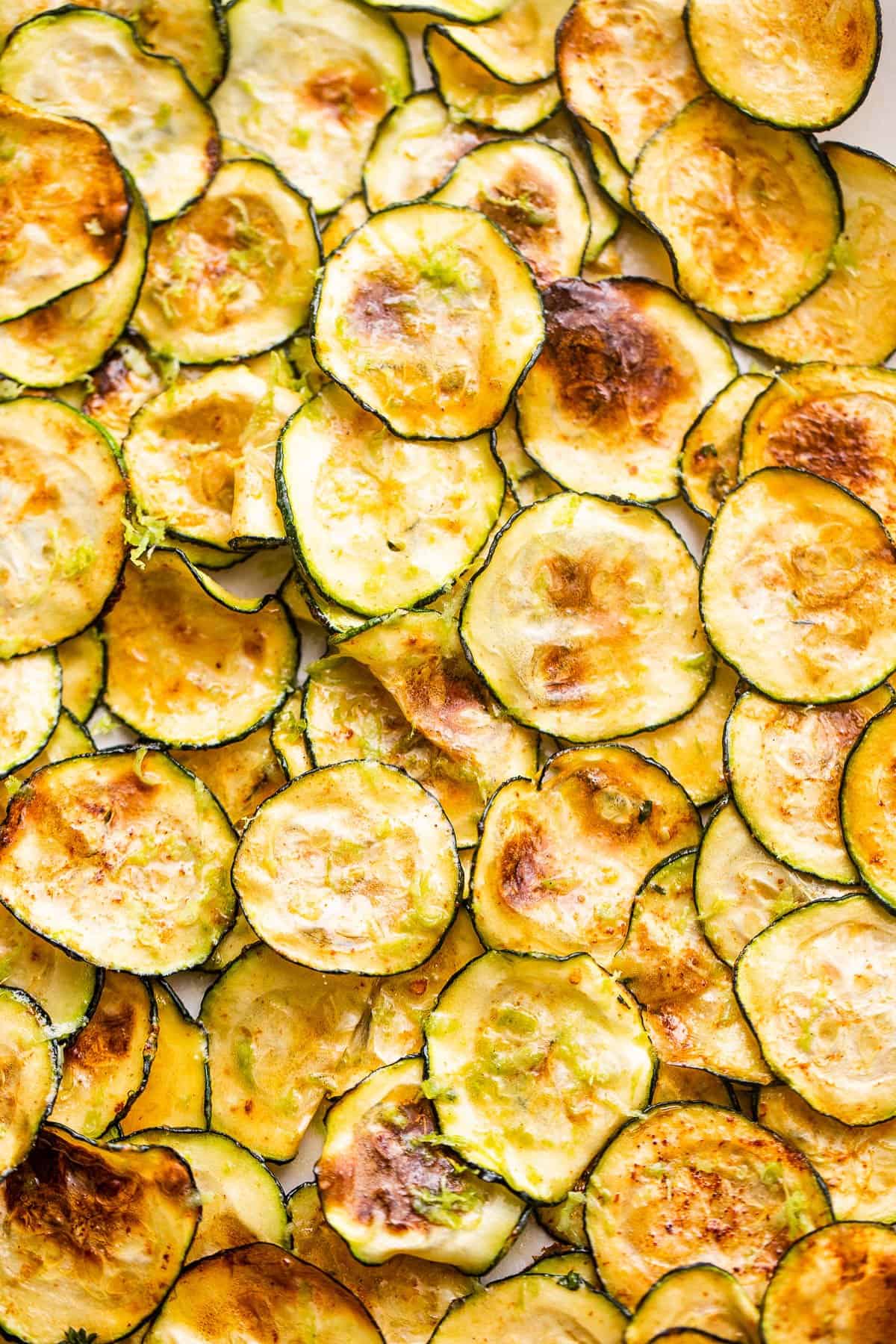 up close picture of zucchini chips cooked in an air fryer