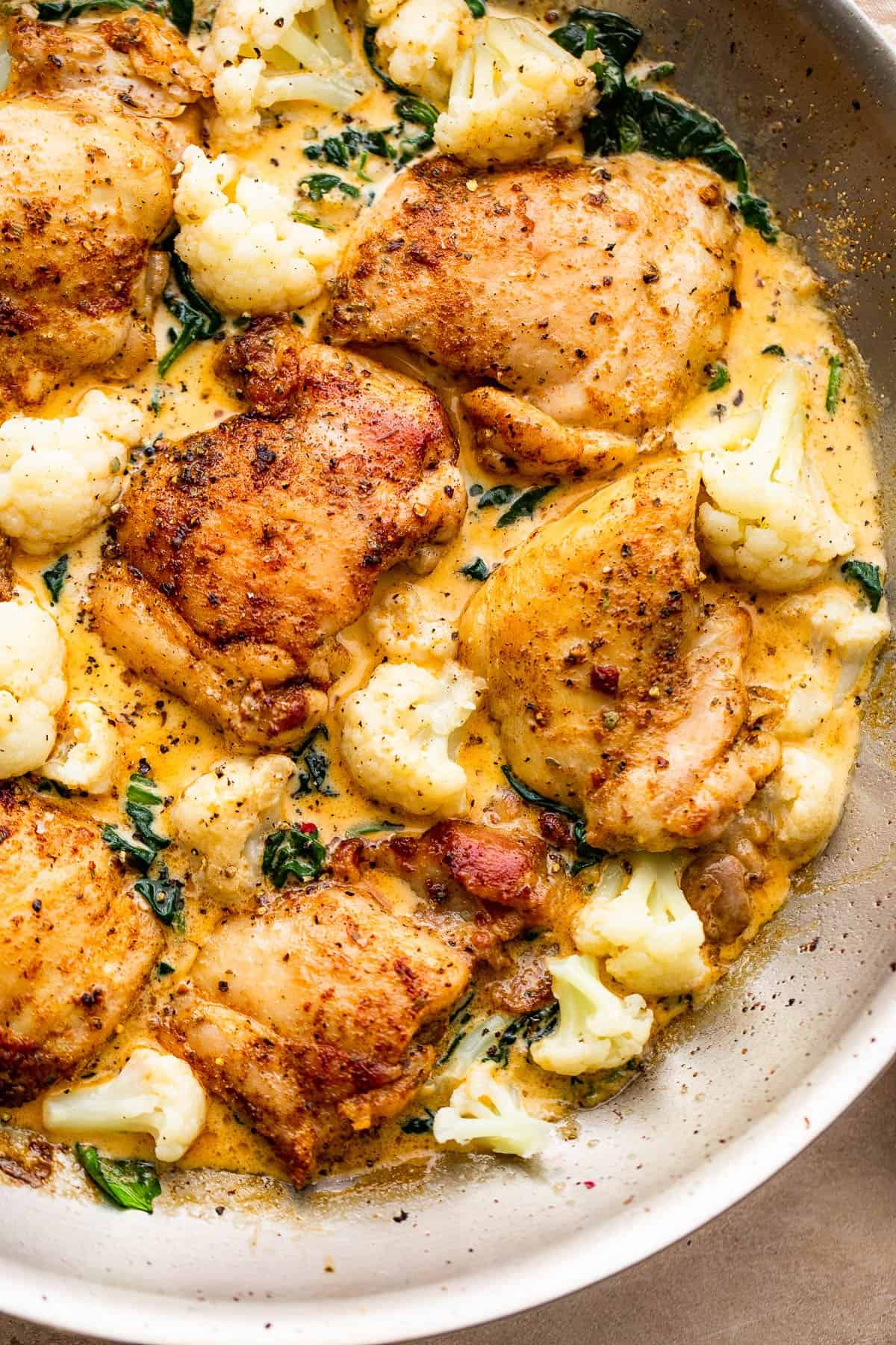 cooking chicken thighs and cauliflower in creamy sauce