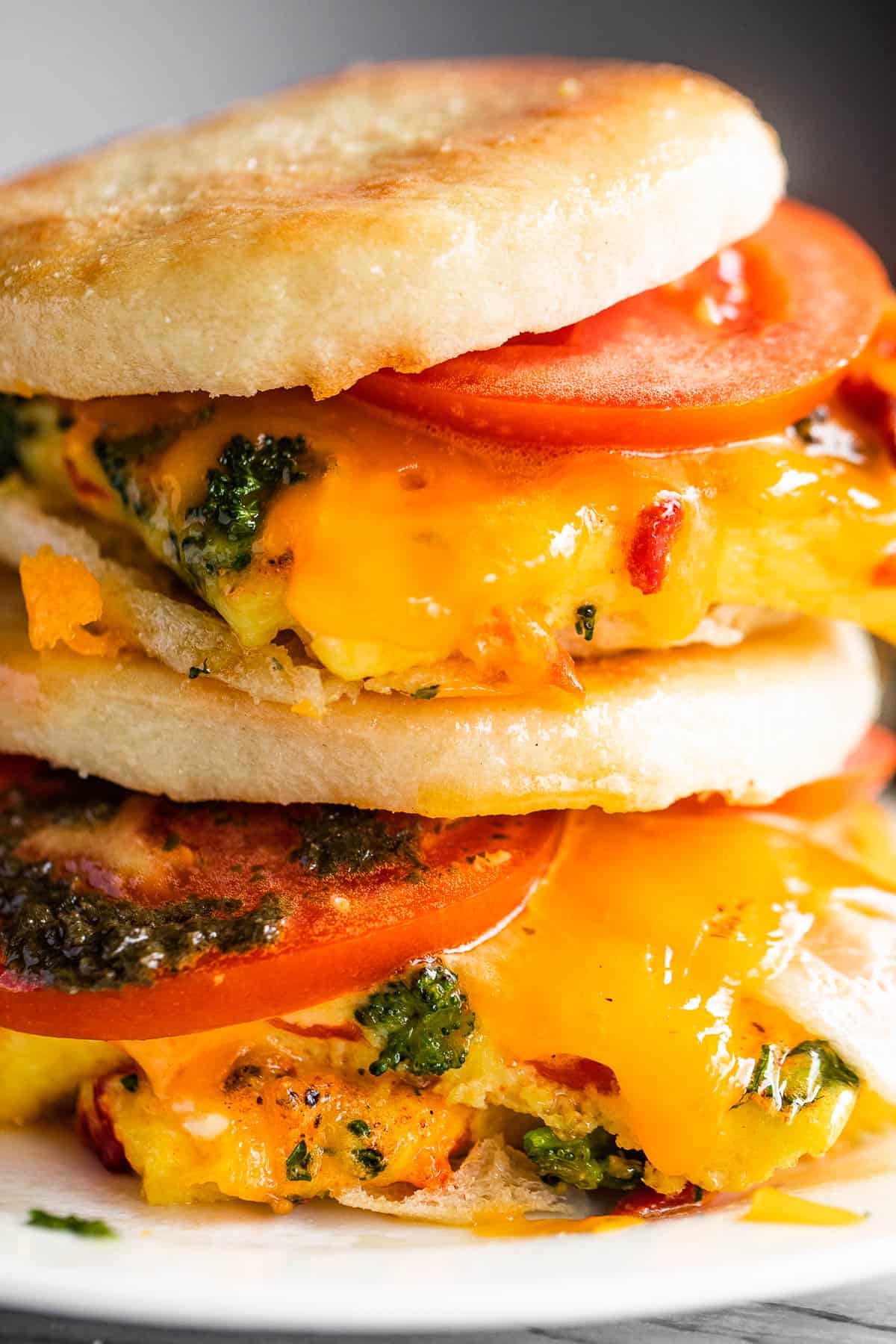 up close shot of english muffin egg breakfast sandwiches