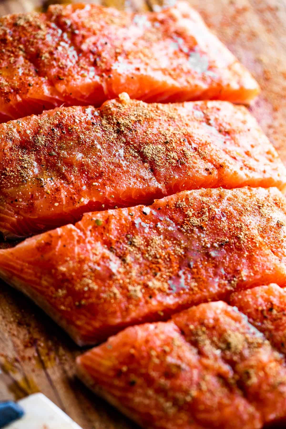up close shot of seasoned raw salmon fillets
