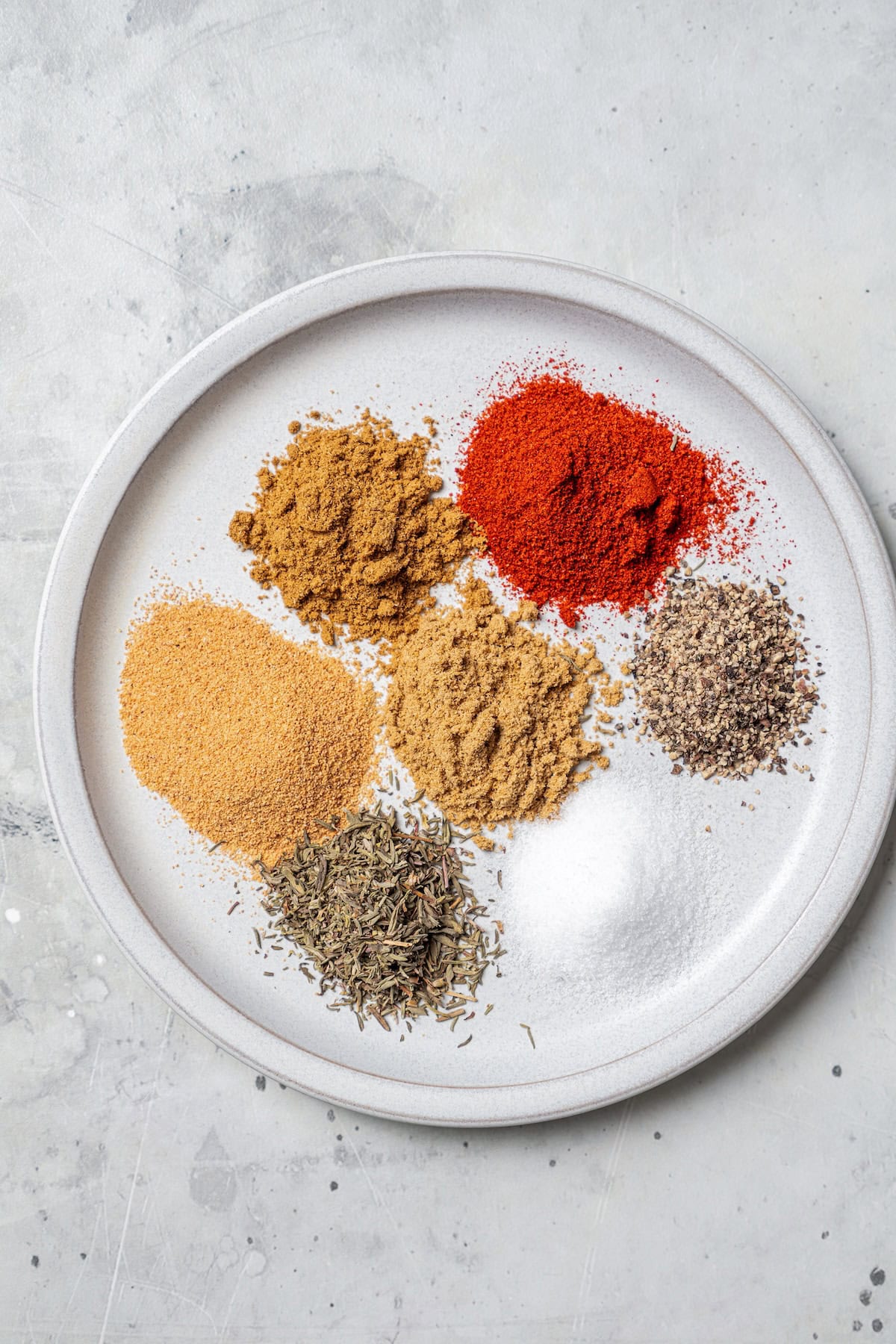 Mediterranean spices on a white plate.