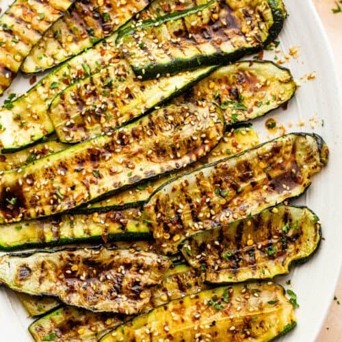 grilled zucchini slices served on an oval serving plate