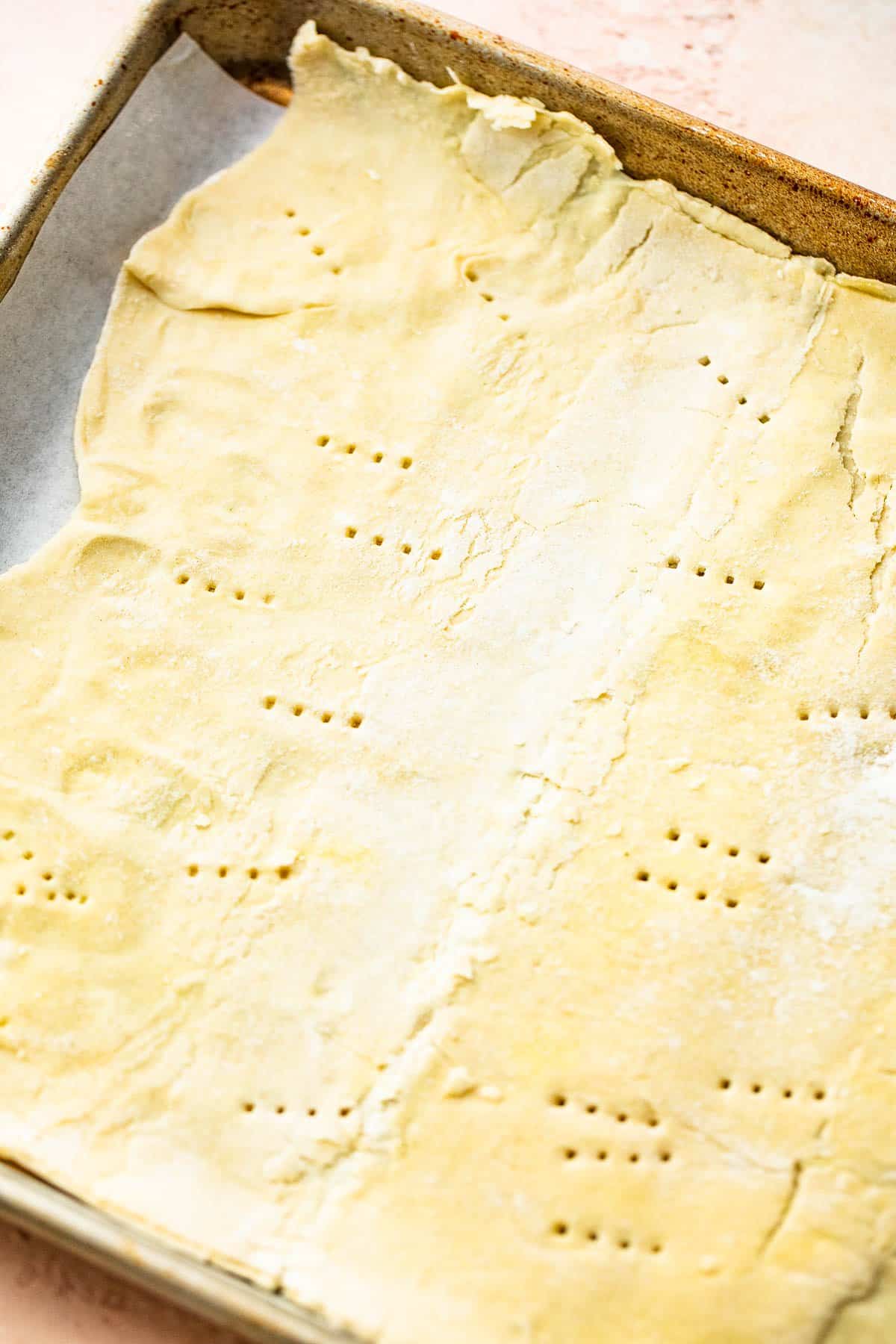 With just 5 ingredients, these Easy Asparagus Tarts with Mozzarella Cheese are quick, easy and versatile. Perfect for brunch & lunch. rolled out puff pastry on a baking sheet