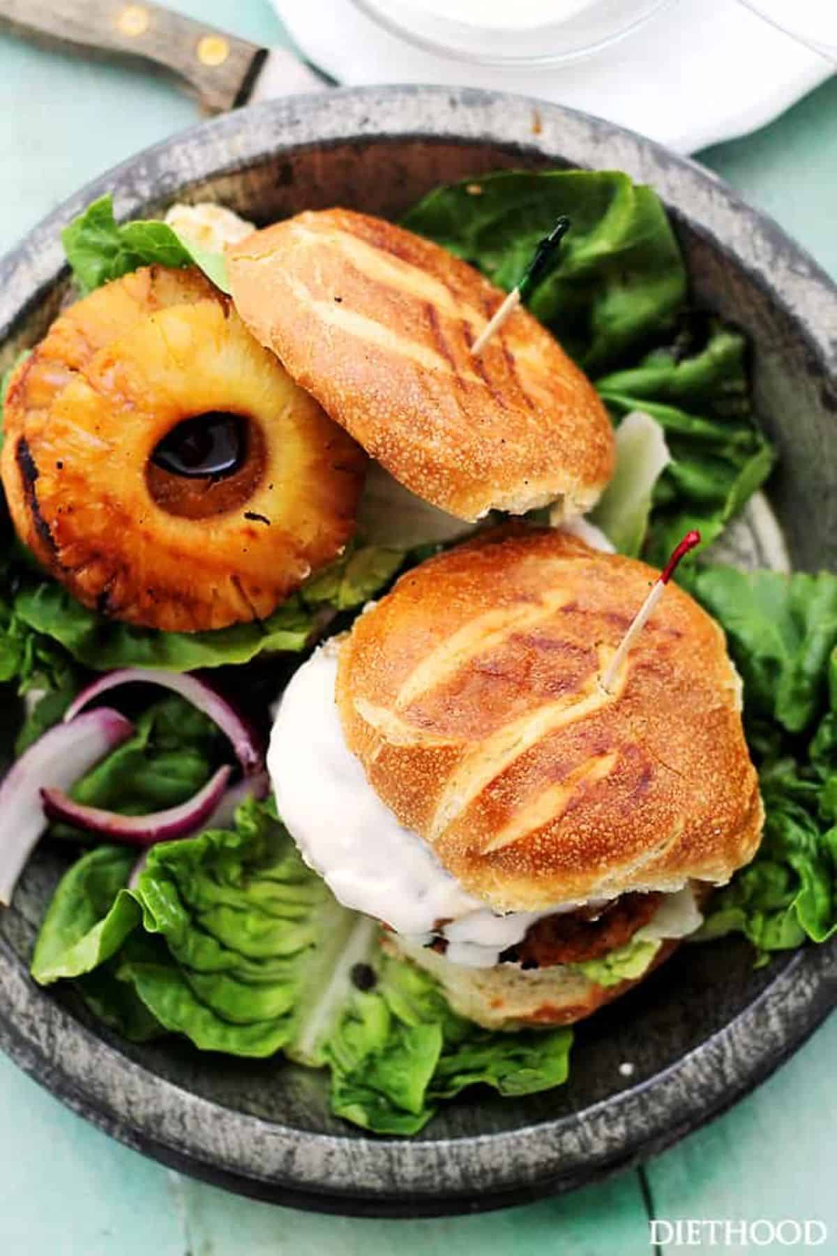 Salmon burgers with pineapple rings.