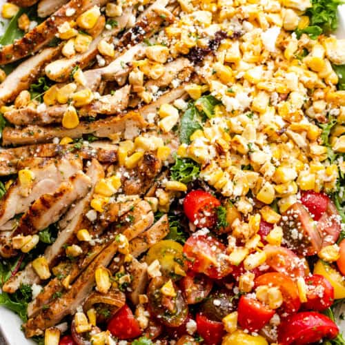 mexican corn chicken salad served on an oblong salad plate