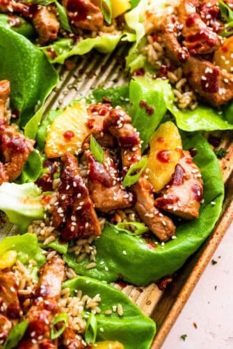 close up of pork lettuce wraps on a sheet pan