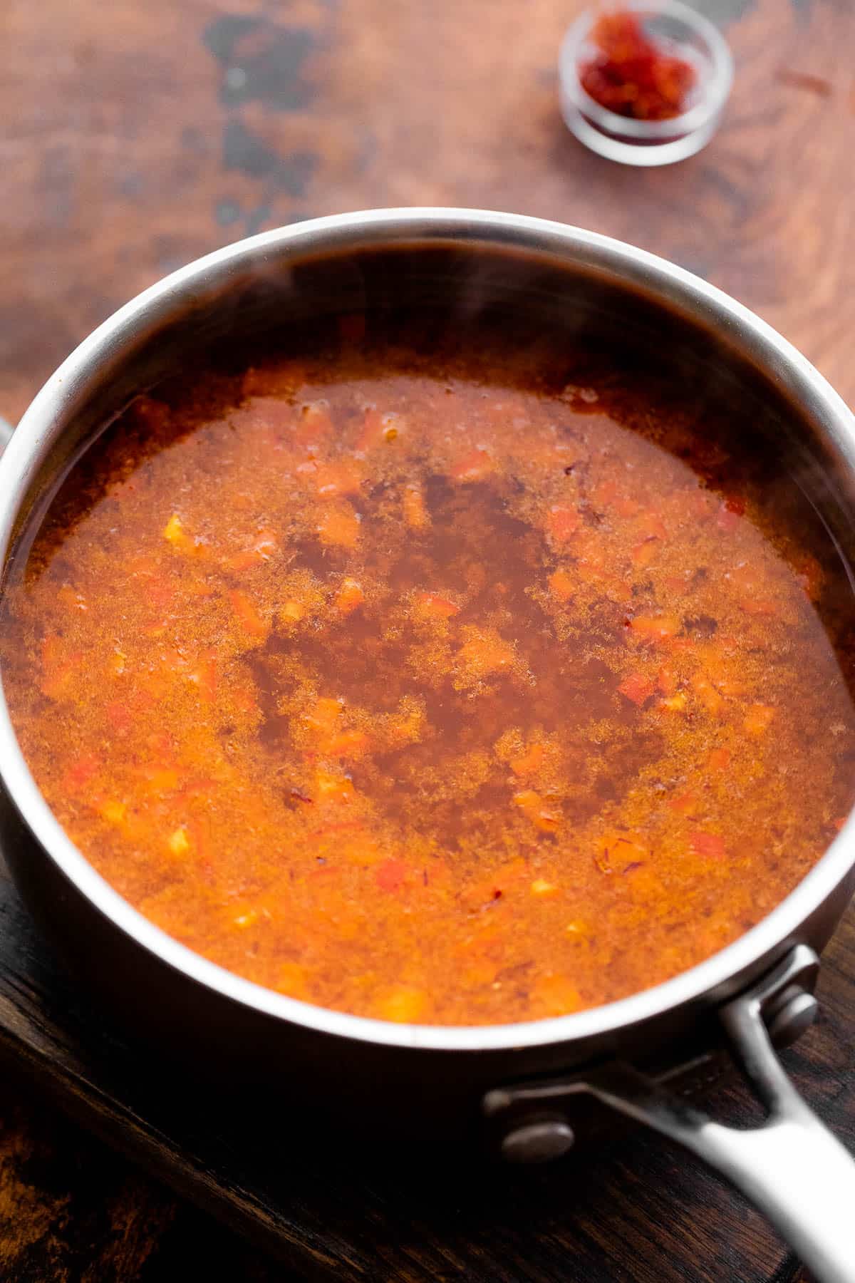 Heating up vegetable broth in a saucepan.